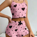 Pijama rosa de short con corazones negros